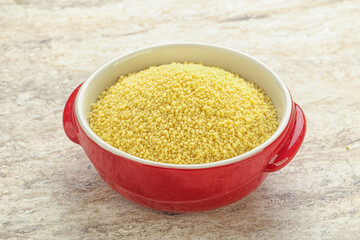 Raw couscous in the bowl
