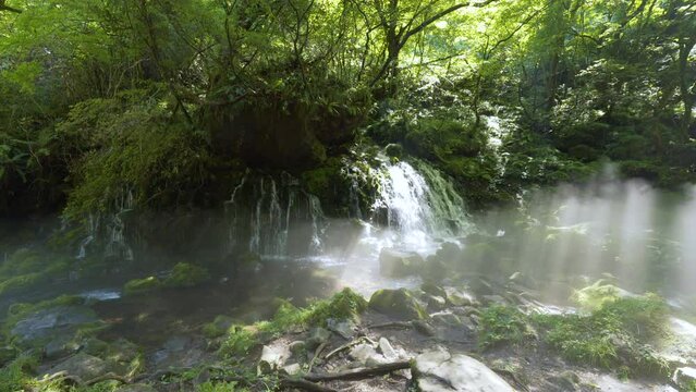 Cinematic gimbal shot of misty Mototaki Fukuryusui Underflow waterfalls in Akita prefecture in Japan