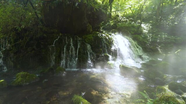 Cinematic gimbal shot of misty Mototaki Fukuryusui Underflow waterfalls in Akita prefecture in Japan
