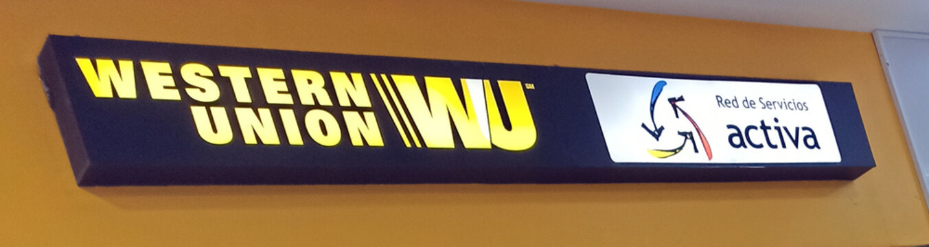 CUENCA, ECUADOR - DECEMBER 23, 2023: emblem of the Western Union international payment system