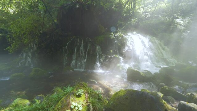 Cinematic gimbal shot of misty Mototaki Fukuryusui Underflow waterfalls in Akita prefecture in Japan