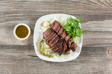 A view of a plate of Lao style beef.