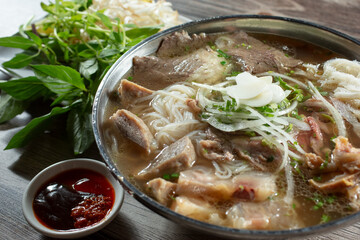 A closeup view of a bowl of beef pho special.
