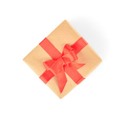 Christmas gift box with red ribbon on white background