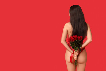 Beautiful young Asian woman in sexy underwear with bouquet of roses on red background, back view. Valentine's Day celebration