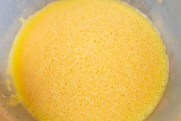 Eggs are mixed together and ready for an omelet.