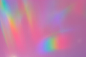 Defocused abstract purple background with rainbow flare from sunlight, holiday backdrop,...