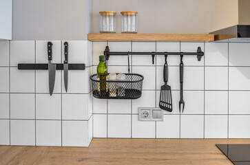 Modern stylish Scandinavian kitchen interior with kitchen accessories. Bright white and grey...