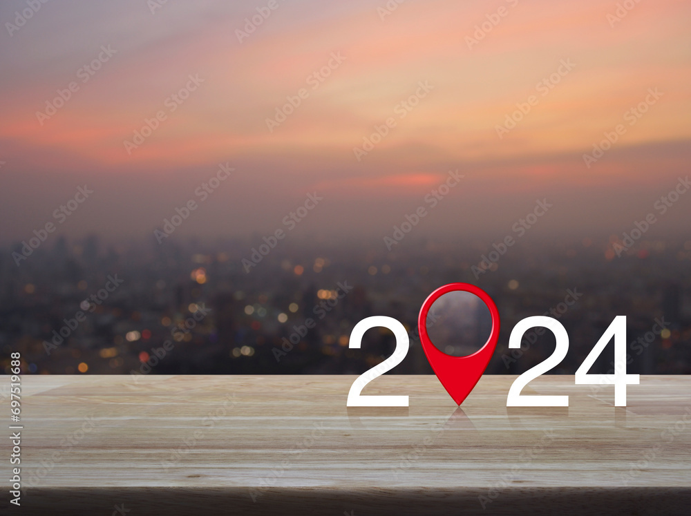 Aufkleber 2024 letter with map pin location icon on wooden table over blur of cityscape on warm light sundown,