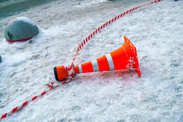 Limiting cone with belt dispenser lying on the snow