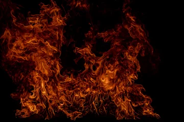 Fotobehang Fire blaze flames on black background. Fire burn flame isolated, abstract texture. Flaming explosion effect with burning fire. © Volodymyr