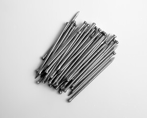 Pile Of Silver Shiny Sharp Metal Nails Isolated On White Background Closeup Photo