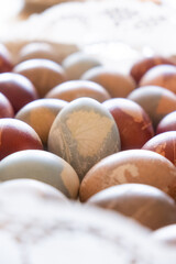 Easter eggs decorated with natural and leaf-like decorations and colored closeup