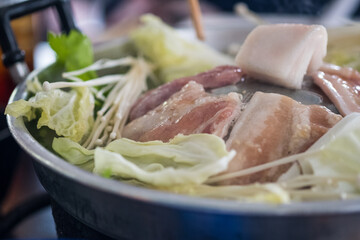 Grilled raw pork on the stove. Thai food buffet. Delicious Thai barbecue style