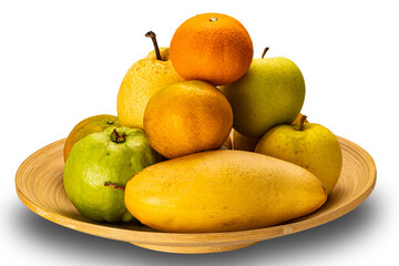 Pile of various fresh organic fruit in bamboo tray isolated on white background with clipping path.