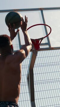 African American guy playing basketball