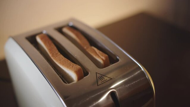 Bread in a toaster jumps out