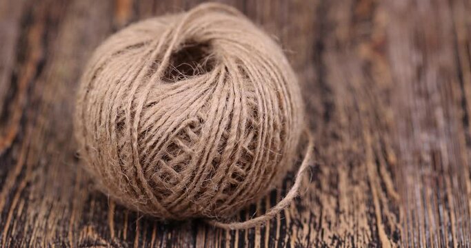 rough linen rope close-up, rough rope on a wooden table
