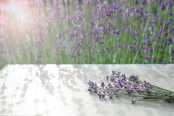 Beautiful background with lavender flowers. Space for demonstration of cosmetics, oils