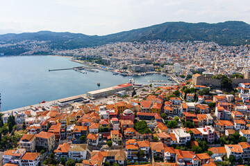 Kavala, Greece. Kavala Fortress - Ruins of a 15th century castle with a round tower. Port. Aerial...