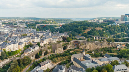 Fototapeta na wymiar Luxembourg City, Luxembourg. Bock Casemates. Panoramic view of the historical part of Luxembourg city. The city is located in a deep valley of two rivers - Alzette and Petrus, Aerial View