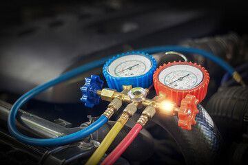 Car maintenance and service Auto mechanic Use a manifold gauge. Check refrigerant and refill car...