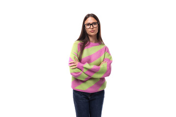 pretty 35 year old feminine model woman dressed in a striped pink-green sweater on a white background