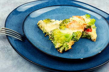 Omelet with cooked shrimp and vegetables.