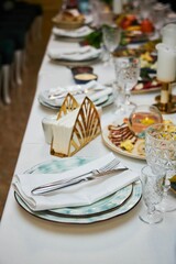 The setting of the festive table. Food and dishes.