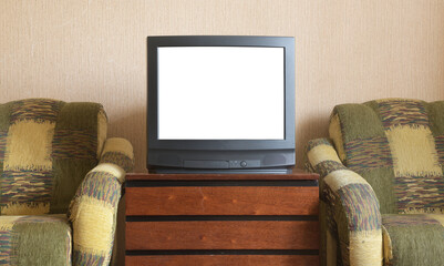 Antique TV with white screen on antique wooden cabinet, vintage design in 80s and 90s style house.
