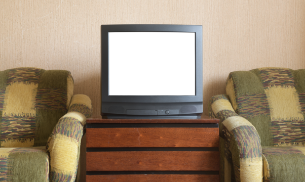 Antique TV with white screen on antique wooden cabinet, vintage design in 80s and 90s style house.