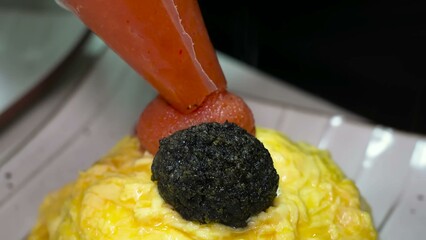A meticulously crafted omelette roll, filled with a tantalizing liquid content