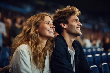 A dynamic duo of football enthusiasts, a man, and a woman, actively participating in the match on the field, radiating sheer joy and passionate support