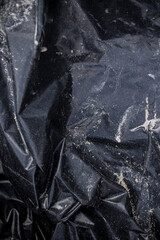 Black plastic garbage bag, black polyethylene texture