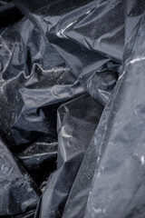 Black plastic garbage bag, black polyethylene texture
