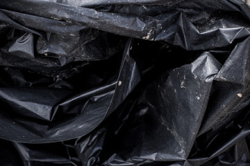 Black plastic garbage bag, black polyethylene texture