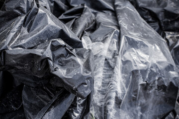 Black plastic garbage bag, black polyethylene texture