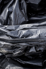 Black plastic garbage bag, black polyethylene texture