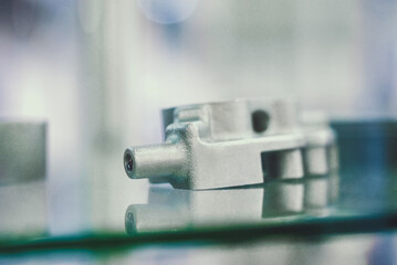 Selective Laser Melting. Object printed on metal 3d printer. Model created in laser sintering machine. DMLS, SLM, SLS technology. Concept of 4.0 industrial revolution. Progressive additive technology.