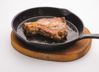 Angus steak fried on vegetable oil on iron cast