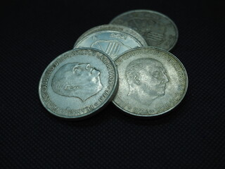Silver coins of 100 pesetas featuring Francisco Franco, the Caudillo.