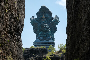 Statue of Patung Garuda Wisnu Kencana on sunny day. Garuda Wisnu Kencana Cultural Park, Bali,...