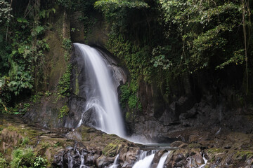 Fototapeta na wymiar Long exposure shot of Taman Sari waterfall. Bali, Indonesia.