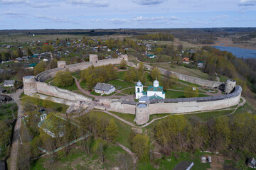 Ancient Izborsk fortress on a May day (shooting from a quadcopter). Pskov region, Russia - obrazy, fototapety, plakaty