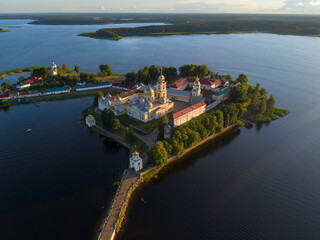 View from the height on the ancient monastery Nilo-Stolobenskaya desert sunny July evening. Tver...