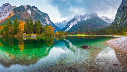 Fototapeta na wymiar beautiful autumn scene of hintersee lake colorful morning view of bavarian alps on the austrian border germany europe beauty of nature concept background