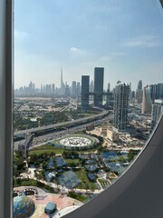 Fototapeta na wymiar Dubai city areal view background. Aerial view of Dubai Downtown skyline, highway roads or street in United Arab Emirates - UAE. 