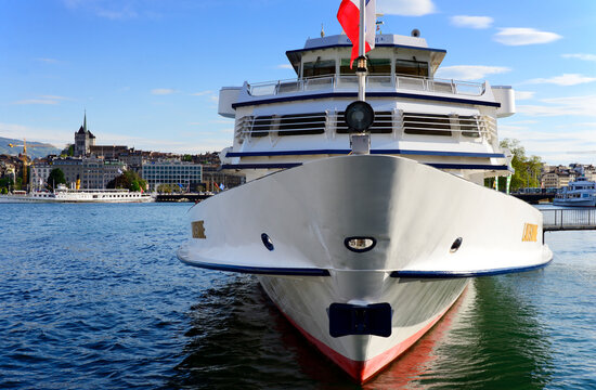 Geneva, Switzerland, Europe - touristic boat - Lausanne - moored in Mont Blanc Port in Geneva, Lake Geneva, other boats and St Pierre Cathedral in background