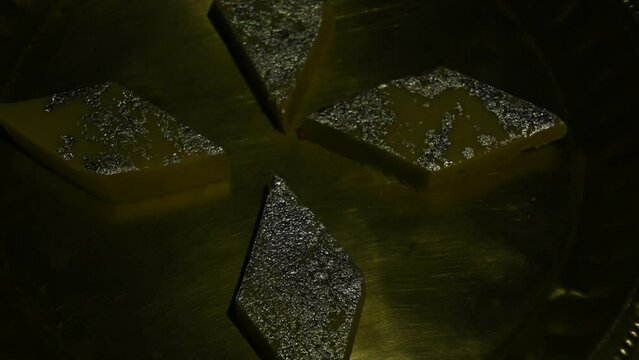 Kaju Barfi or cashew fudge candy. If is a popular Indian sweet for Diwali Dussehra Holi ganesh chaturthi and Ram navami festival. It is made by mixing cashew nuts, milk and sugar. kaju or cashew katli