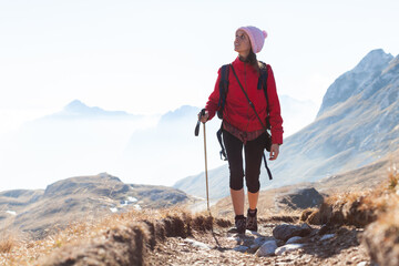 Young Woman Hiker Enjoying Tranquility Digital Detox Hike in beautiful Alpine Environment over The...